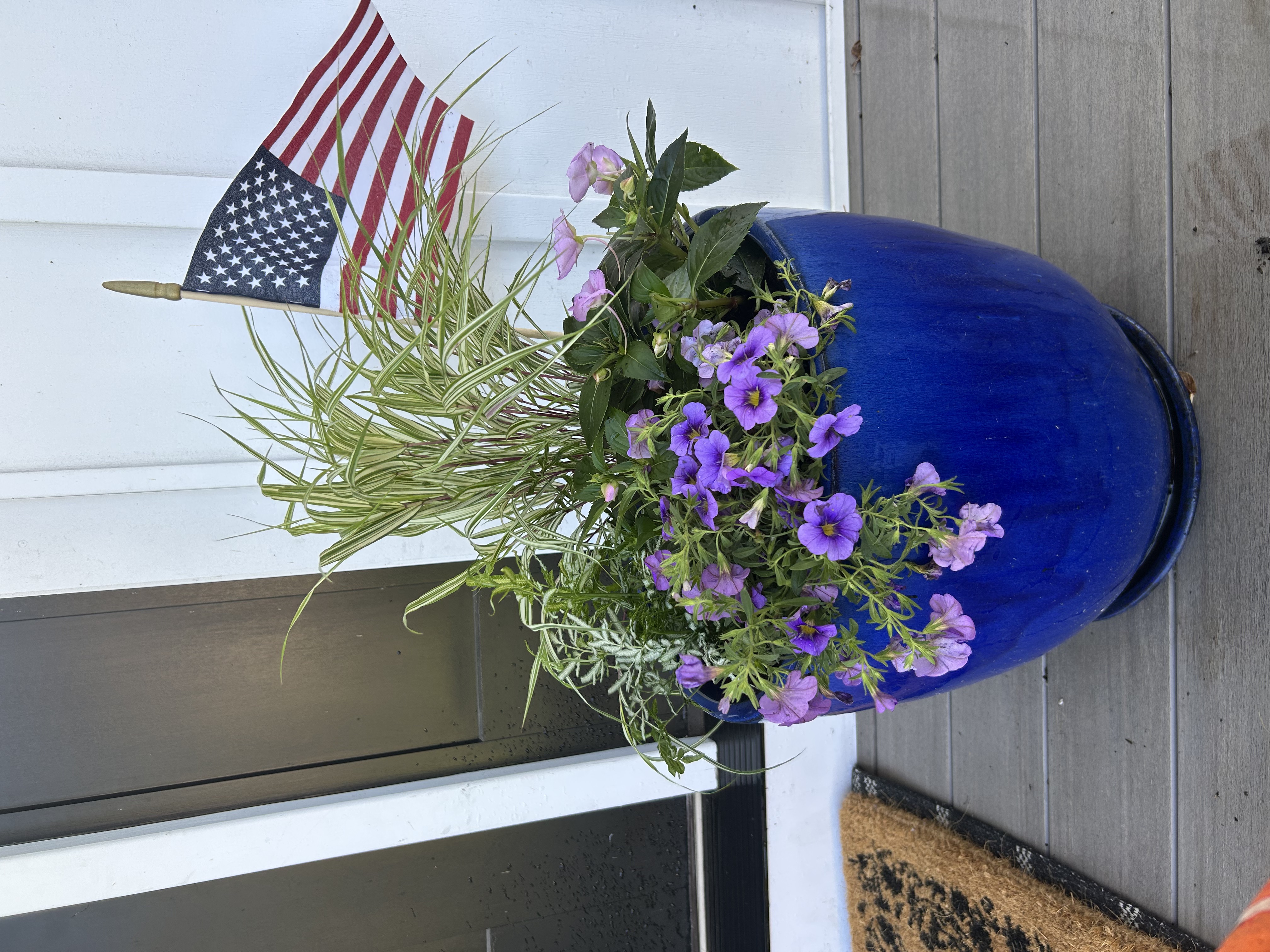 D&E Gardens blue planter with purple flowers